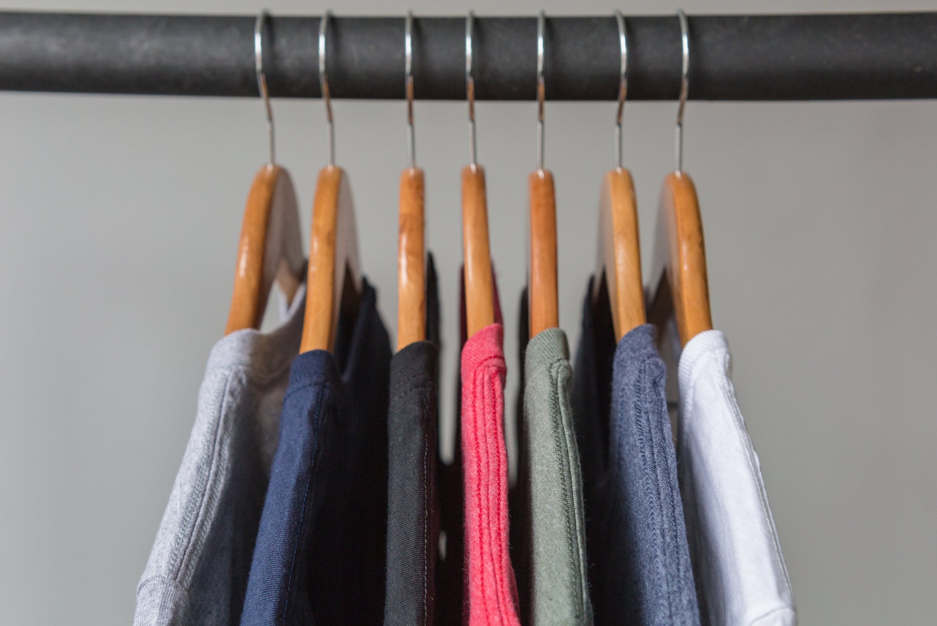 t-shirts on hangers on a rack