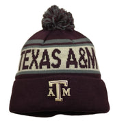 Maroon beanie with pom-pom and 'Texas A&M' text on a white background
