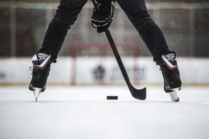 Hockey player stickhandling a puck